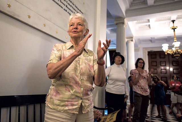 Robin Lloyd joining in a song during a Vermont Poor People's Campaign rally at the Vermont Statehouse - GLENN RUSSELL