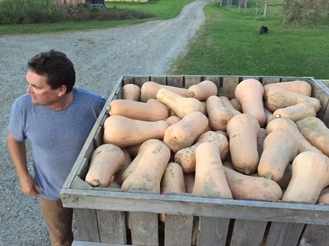 Eric Rozendaal with his butternut squash at Rockville Market Farm in Starksboro - SALLY POLLAK