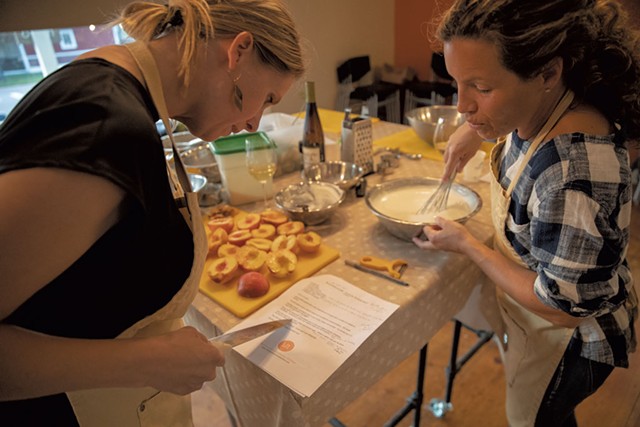 Students preparing peaches for dessert at a Richmond Community Kitchen class - JAMES BUCK
