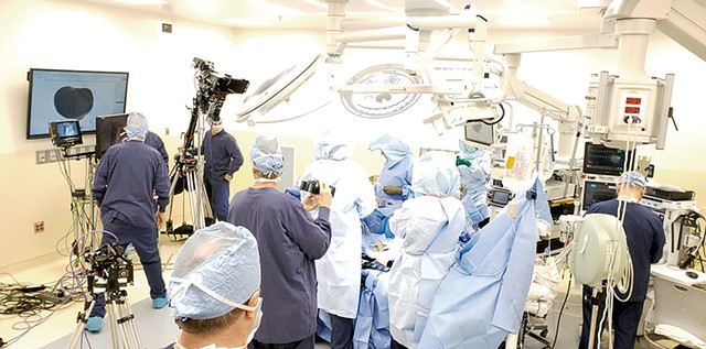 A film crew shooting Dr. Bryan Huber in surgery - COURTESY OF VARISES