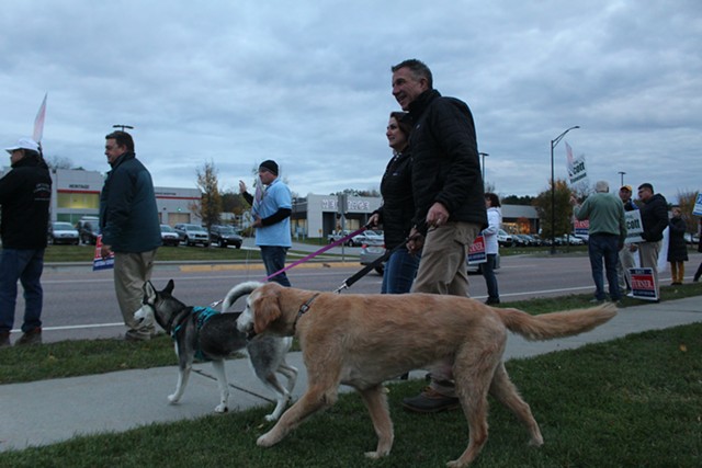Phil Scott arrives in South Burlington with wife Diana and their dogs, Denali and Tucker. - PAUL HEINTZ