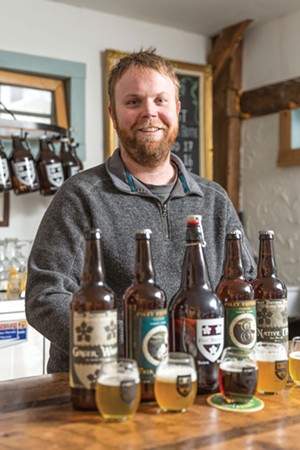 Dan Foley of Foley Brothers Brewery stands at the tasting counter. - OLIVER PARINI