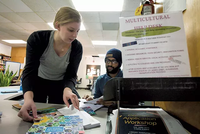 Allison Bailey of the U.S. Committee for Refugees and Immigrants Vermont (left) and Rabin Dahal of Spectrum Youth & Family Services staffing the Spectrum Multicultural Help Desk - GLENN RUSSELL