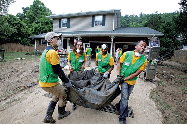 Church members cleaning up after severe flooding in West Virginia - COURTESY OF WORLD MISSION SOCIETY CHURCH OF GOD