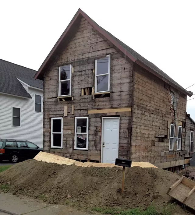 August 2014: The house is stripped back to the frame and jacked up to allow work on the basement foundation. - COURTESY OF GRAHAM MACHARG