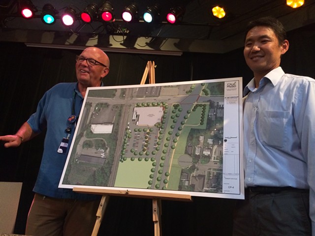 Pat Burns, left, and John Tashiro show plans for City Market's South End store. - ALICIA FREESE