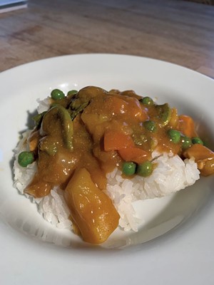 Vermont Curry prepared with added peas, - carrots, fiddleheads and organic chicken - DAN BOLLES