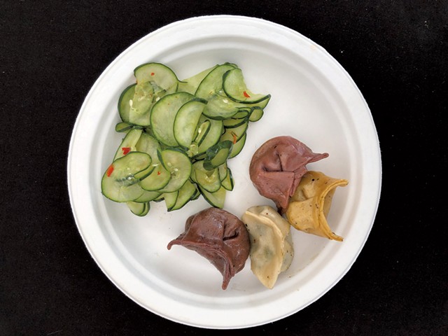 Marinated cucumber and potsickers from Green Mountain Potstickers - DAVID HOLUB
