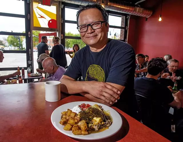 Owner Jake Tran with a pork carnitas omelette at the Firebird Café - GLENN RUSSELL