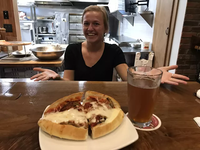 Sara Rooke serves an eggplant parmesan hero at Mimmo's - SALLY POLLAK