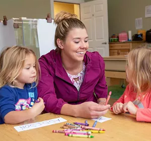 Brianna Hawksworth spending a few minutes with her daughters, Addison and Aubree, before leaving for work - WAYNE TARR