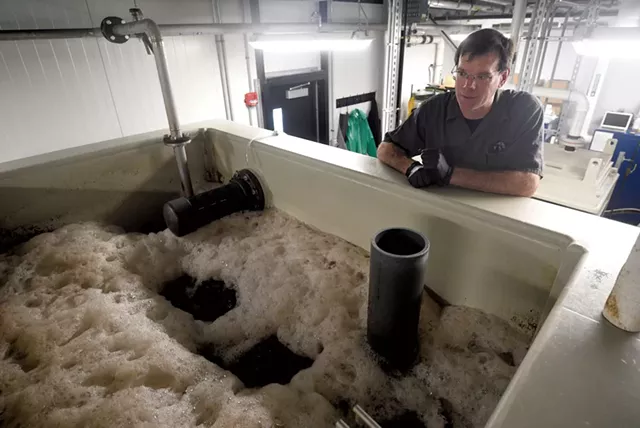 Steve Miller observing one of the Alchemist's on-site wastewater treatment tanks in Stowe - JEB WALLACE-BRODEUR