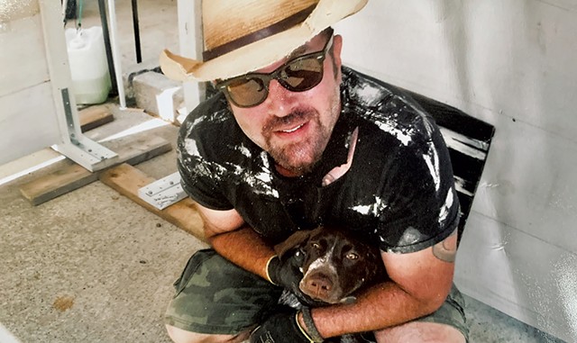 Jonnie Davis and his dog, Chili, at the Rutland Farmers Market - COURTESY PHOTO