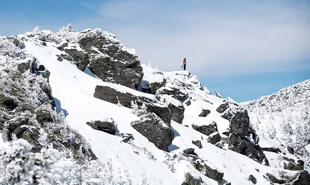 A snowboarder on the ridgeline of Mount Mansfield - NATHANAEL ASARO
