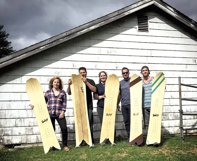 Students with their PowderJet snowboards - COURTESY OF POWDERJET SNOWBOARDS