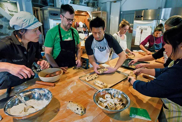 Heike Meyer (left) helping students prepare loaves of stollen - GLENN RUSSELL