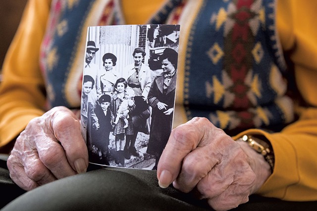 Jane Keibel holding a photo taken in France, 1939, when she was 15 - COLIN FLANDERS