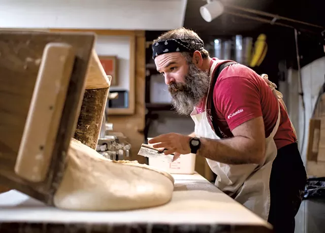 Trent Cooper preparing to portion and shape sourdough bread into bâtards - GLENN RUSSELL