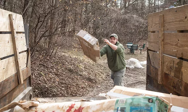 Kyler Leduc loading a truck for Grunts Move Junk in Burlington - LUKE AWTRY