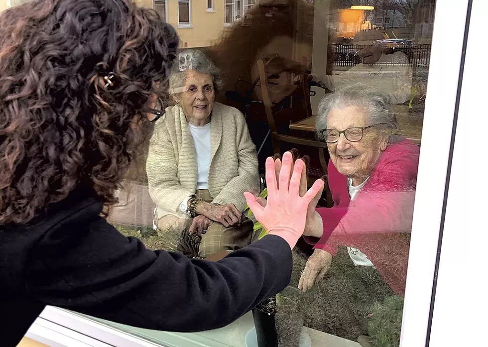 Paula Routly "visiting" with her mother, Angie, at the Converse Home. Also pictured: Sue Haman - COURTESY OF SUZIE MCCOY