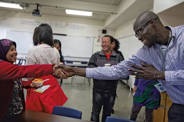 Ali Dieng, right, welcoming Khinaye Lwin, left, to Parent University - JAMES BUCK