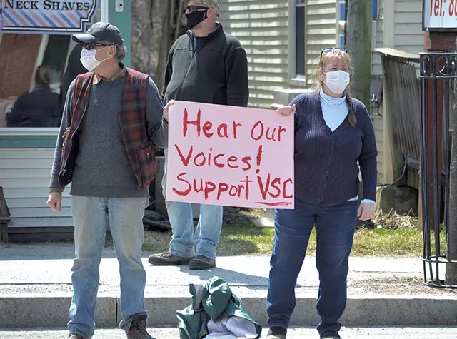 Protesters in Johnson urging passersby to support the colleges - COURTESY OF KRYSTAL WOODWARD