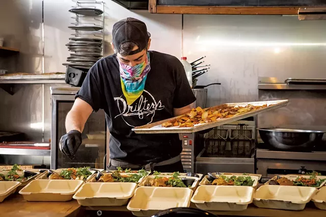 Andrew Ryan preparing meals at Drifters - LUKE AWTRY