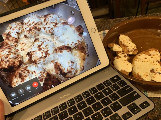 Broiled cheese-topped chicken thighs seen via FaceTime in Massachusetts and chicken breasts In Vermont - MELISSA PASANEN