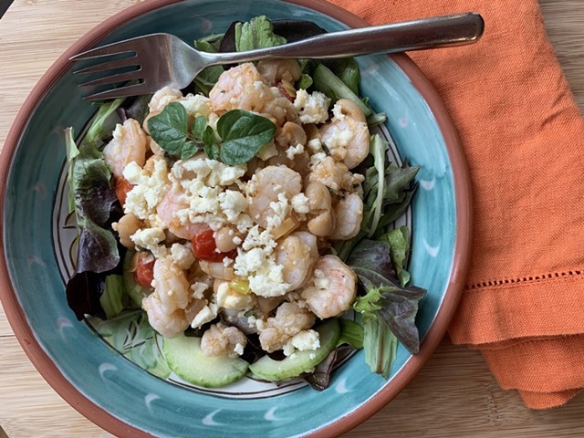 Shrimp with tomatoes and white beans served over greens - MELISSA PASANEN