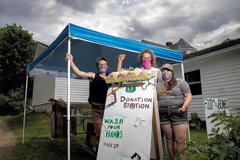 From left: Austin Kahn, Sam Bliss and Emma Schoenberg of Food Not Bombs - JAMES BUCK