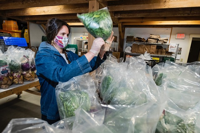 Andrea Solazzo, Vermont Foodbank agriculture and community outreach manager, packs produce for food shelf delivery - COURTESY OF VERMONT FOODBANK