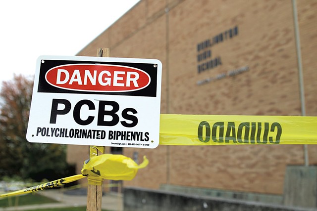 Signs warning about PCBs at Burlington High School - COURTNEY LAMDIN ©️ SEVEN DAYS