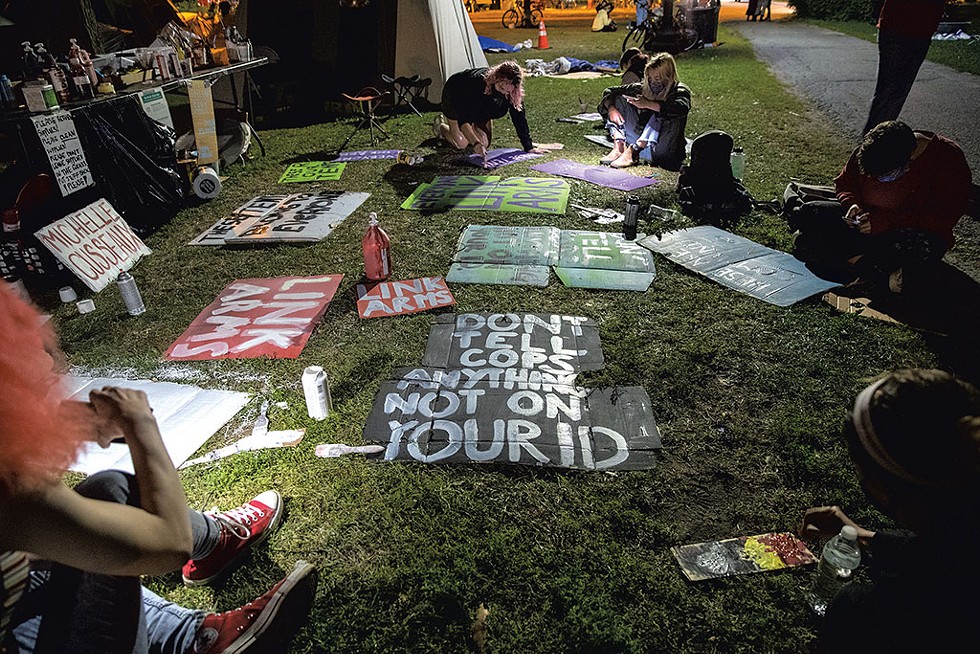 Protesters making signs - JAMES BUCK