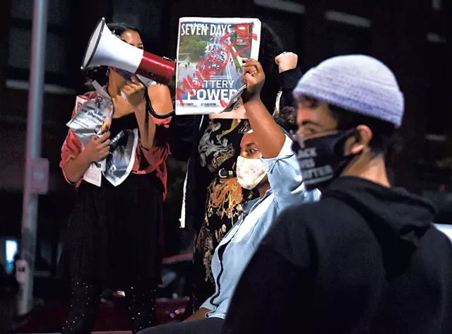 Protesters with copies of Seven Days at last Thursday's demonstration in Burlington - COURTESY OF MATT HEASLEY