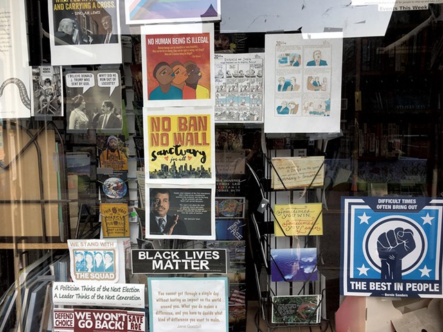 Political signs in a Brattleboro storefront - PAMELA POLSTON ©️ SEVEN DAYS