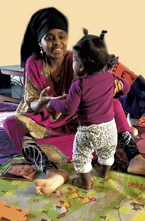 A mom working with her child on gross motor skills during a home visit - COURTESY OF CHAMPLAIN VALLEY HEAD START