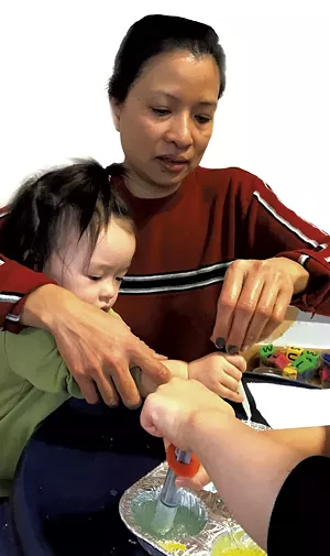 A mom and her child doing a science project during a home visit - COURTESY OF CHAMPLAIN VALLEY HEAD START