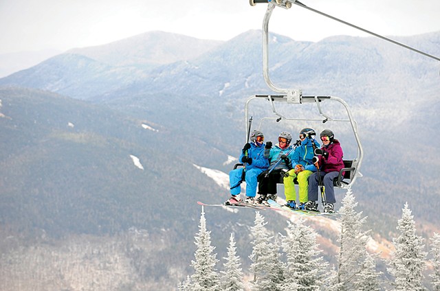 Skiers on a lift at Stowe Mountain Resort, pre-COVID - FILE: JEB WALLACE-BRODEUR ©️ SEVEN DAYS