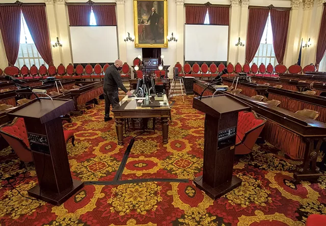 State Curator David Schutz checking on the layout of the House chamber - JEB WALLACE-BRODEUR