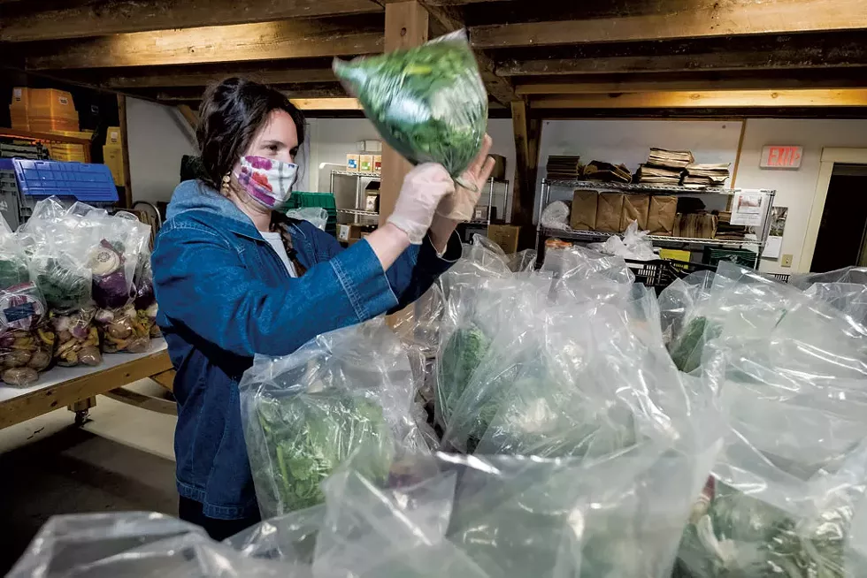 Preparing food for distribution - COURTESY OF THE VERMONT FOODBANK