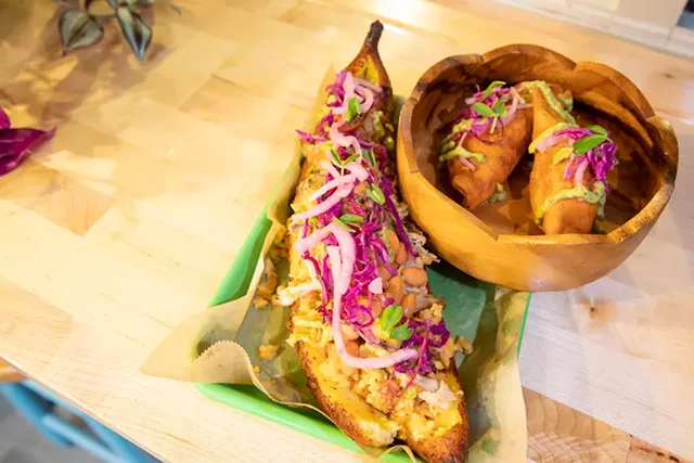 A stuffed canoa and empanadas at Café Mamajuana - JAMES BUCK