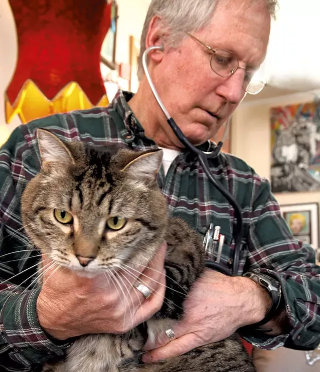 Dr. Sturgis listening to Buddy's heart - MATTHEW THORSEN