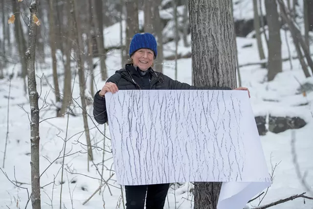 Elizabeth Billings holding a tree rubbing - DARIA BISHOP