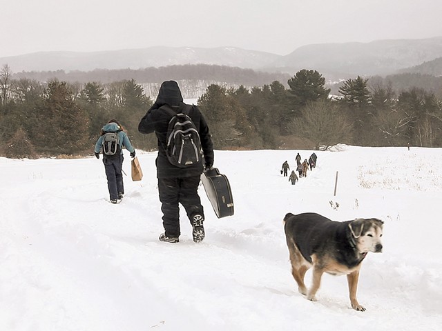 Students hiking down to base camp with Schlein's dog, Puck - CAT CUTILLO
