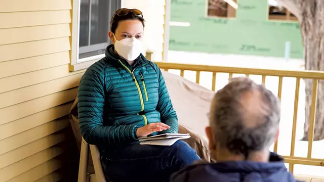 Samantha Ford speaking with Steve Goldstein at his home in Shelburne - LUKE AWTRY