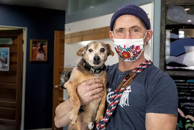 Whitney Troy-Vowell with one of his dogs, Mac - LUKE AWTRY