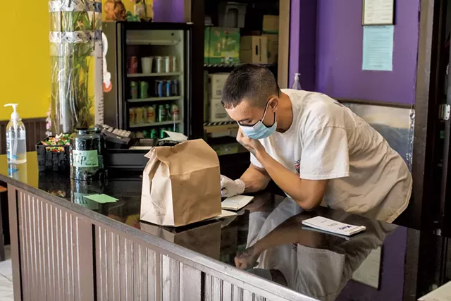 Con Nguyen behind the counter at Pho Hong - LUKE AWTRY