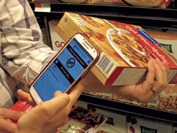 Scanning a cereal box with the WICShopper app - MATTHEW THORSEN