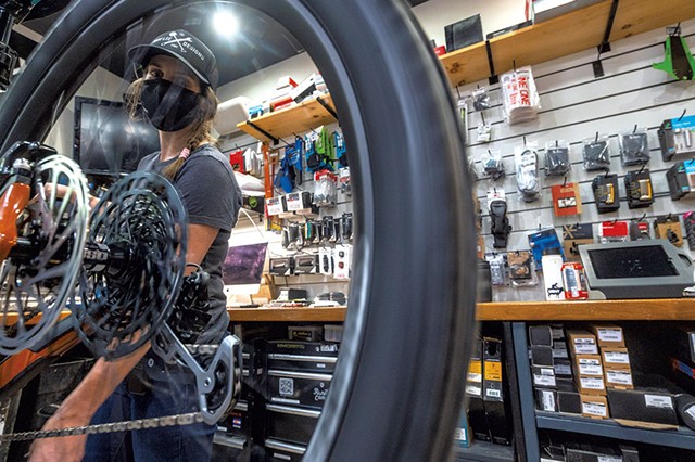 Shop manager Mar Kuhnel &#10;tuning a bike at Ranch Camp - JEB WALLACE-BRODEUR