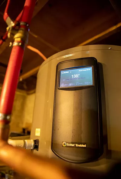 The heat pump water heater in the Fink's basement - JAMES BUCK